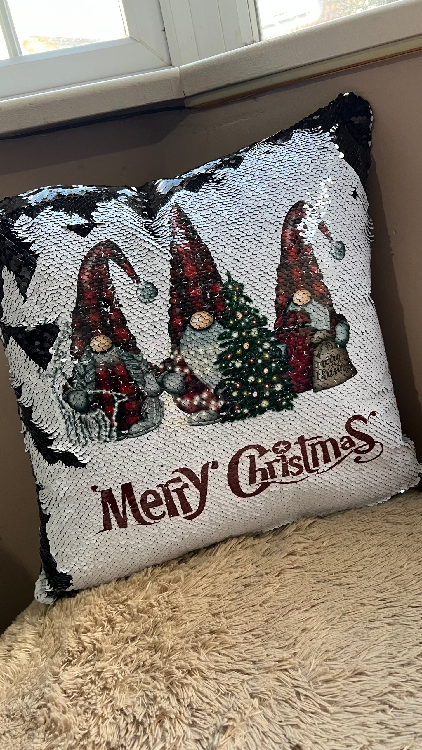 Decorative pillow with Christmas themed Gnome design with 'Merry Christmas' text.