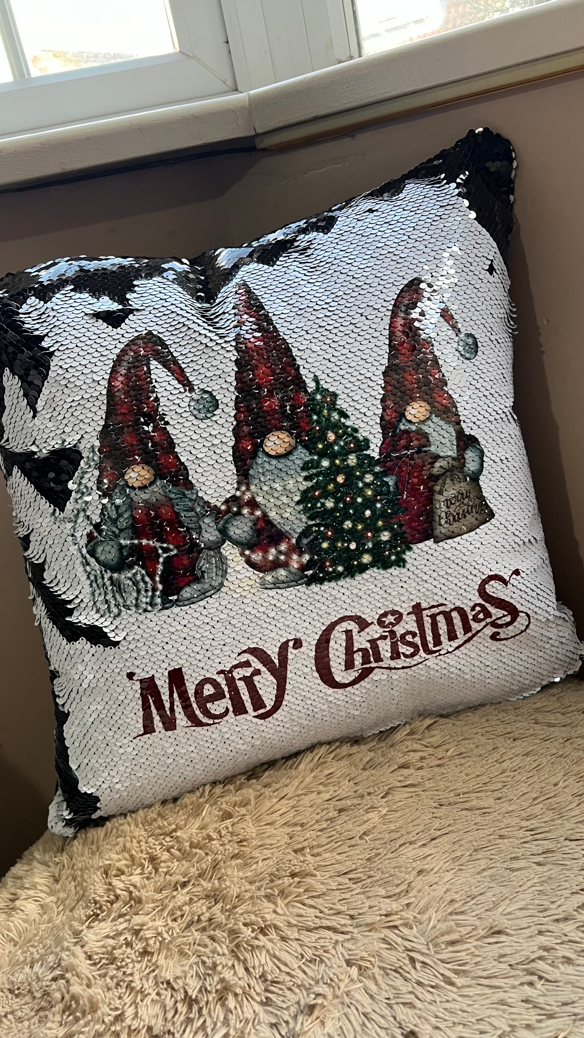 Decorative pillow with Christmas themed Gnome design with 'Merry Christmas' text.