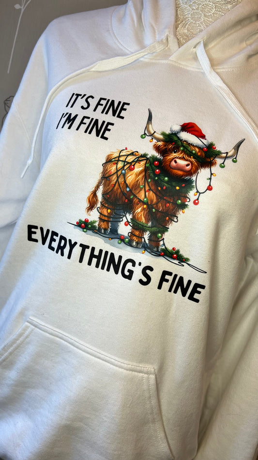 Hoodie with a Christmas-themed design featuring a yak and text on a white background